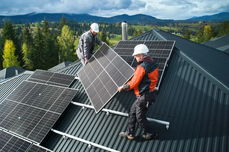 Technicians installing solar panels